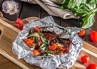 Tilapia and veggies in foil packet